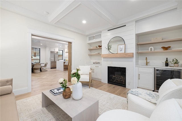 7 Champlin St, Newport, RI 02840 - living room featuring baseboards, beamed ceiling, light wood finished floors, wine cooler, and a premium fireplace