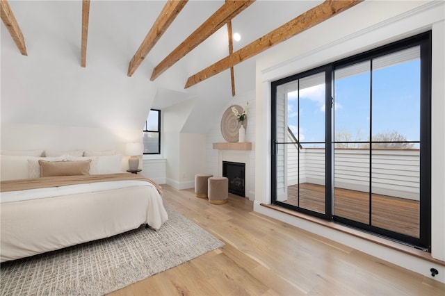 7 Champlin St, Newport, RI 02840 - bedroom with baseboards, lofted ceiling with beams, wood finished floors, and a large fireplace
