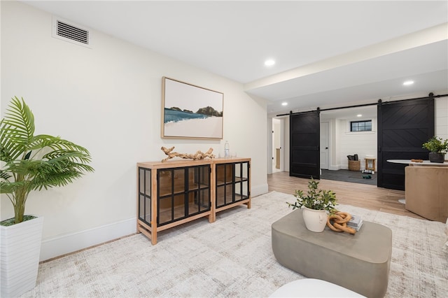7 Champlin St, Newport, RI 02840 - living room with baseboards, recessed lighting, a barn door, and visible vents