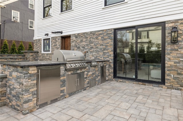 7 Champlin St, Newport, RI 02840 - view of patio / terrace featuring fence, grilling area, and an outdoor kitchen