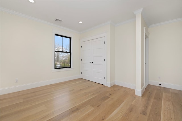 7 Champlin St, Newport, RI 02840 - unfurnished bedroom featuring crown molding, baseboards, light wood-type flooring, and visible vents