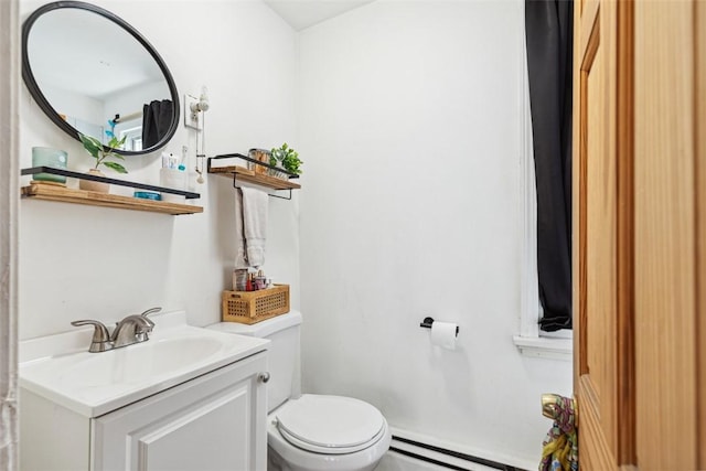 67 Pleasant St, Westerly, RI 02891 - bathroom featuring vanity, baseboard heating, and toilet