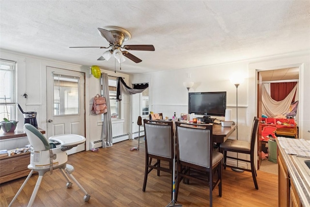 67 Pleasant St, Westerly, RI 02891 - dining area featuring a ceiling fan, a textured ceiling, and wood finished floors