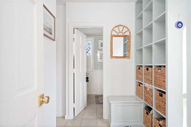 interior space with baseboards and tile patterned floors