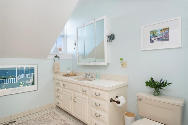 bathroom with vanity, tile patterned floors, visible vents, and toilet