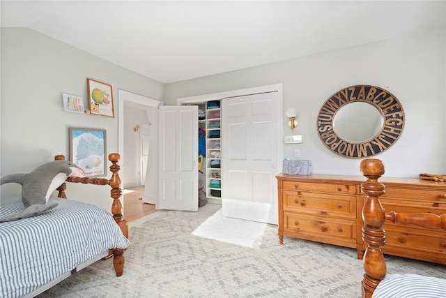 bedroom with a closet and wood finished floors