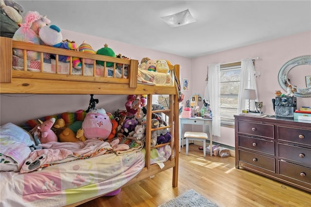 bedroom with light wood-type flooring