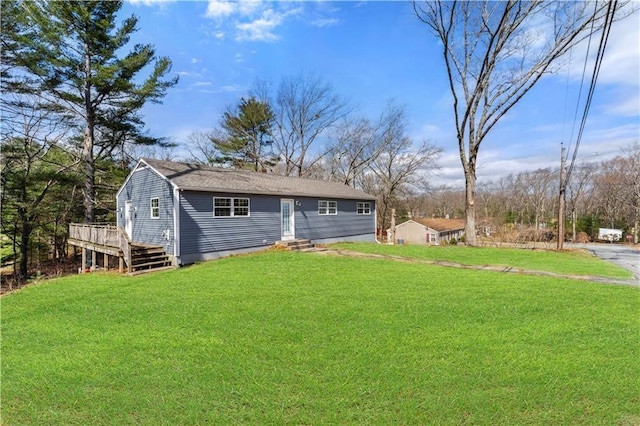 exterior space with a yard and a deck