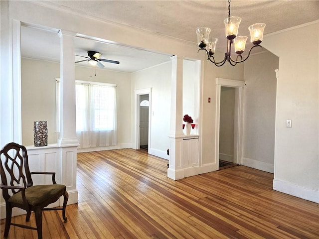 168 Spring St, Woonsocket, RI 02895 - dining area featuring baseboards, ornamental molding, hardwood / wood-style flooring, and ceiling fan with notable chandelier