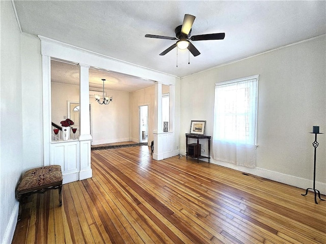 168 Spring St, Woonsocket, RI 02895 - unfurnished room featuring ornamental molding, wood-type flooring, and ceiling fan with notable chandelier
