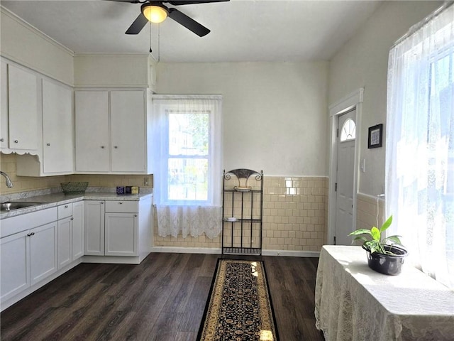 168 Spring St, Woonsocket, RI 02895 - kitchen with a ceiling fan, dark wood-style flooring, a sink, light countertops, and white cabinetry