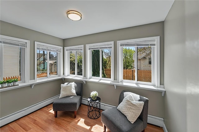 sunroom featuring baseboard heating