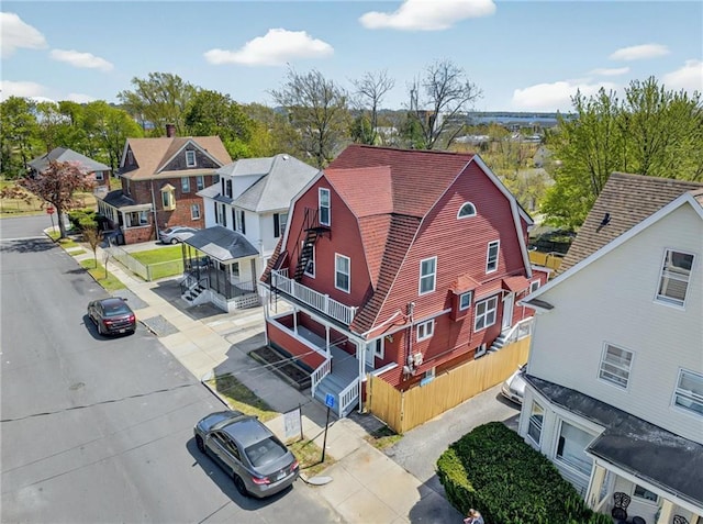 birds eye view of property with a residential view