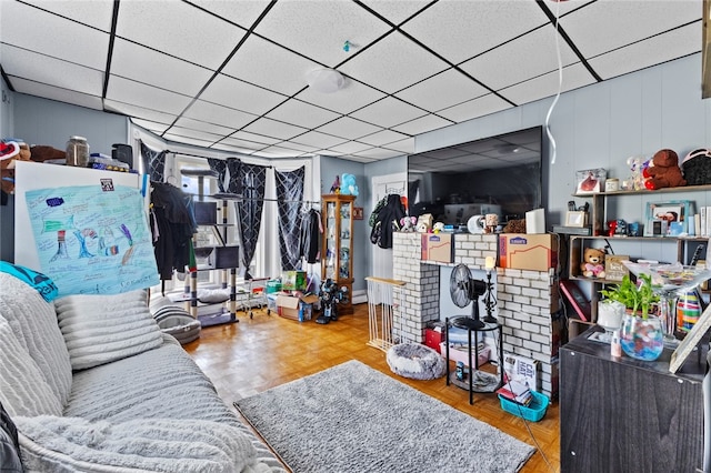 interior space featuring a drop ceiling