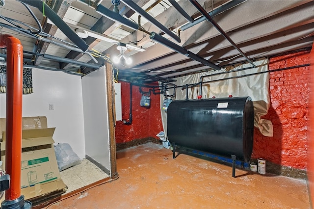 unfinished basement featuring heating fuel