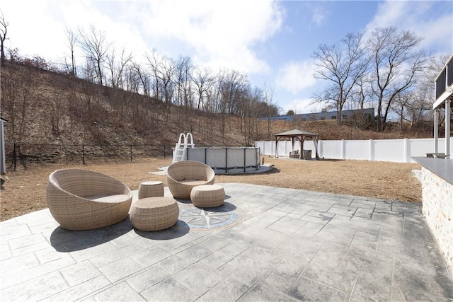 32 Dike St, Woonsocket, RI 02895 - view of patio with a gazebo, an outdoor pool, and a fenced backyard