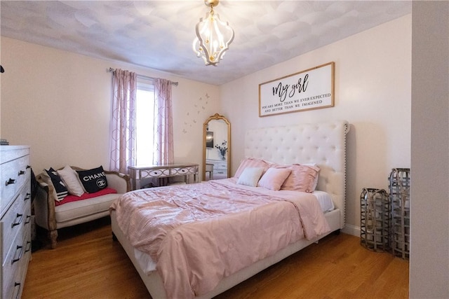 32 Dike St, Woonsocket, RI 02895 - bedroom featuring an inviting chandelier and wood finished floors
