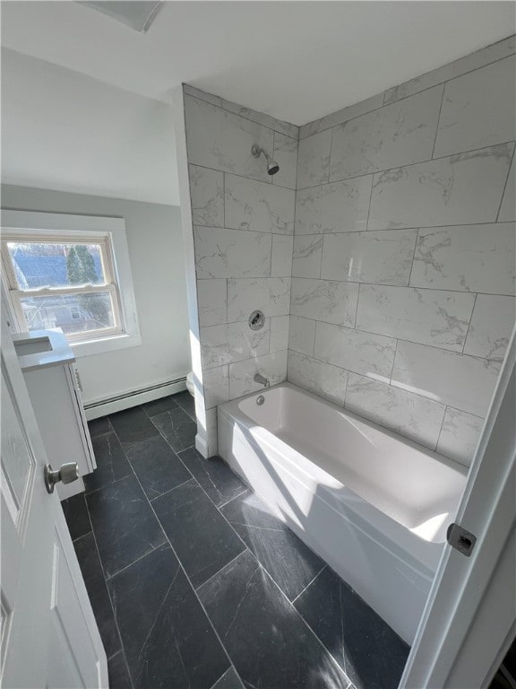 bathroom with vanity, marble finish floor, tub / shower combination, baseboards, and a baseboard radiator