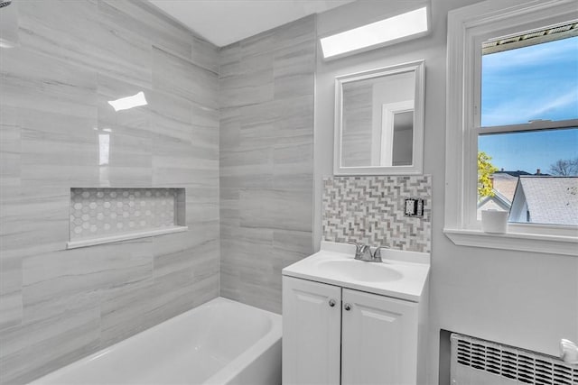 32 Summer St, Woonsocket, RI 02895 - bathroom with radiator, tasteful backsplash, shower / bathing tub combination, and vanity