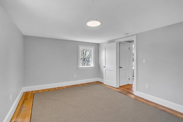 32 Summer St, Woonsocket, RI 02895 - spare room with baseboards and wood finished floors
