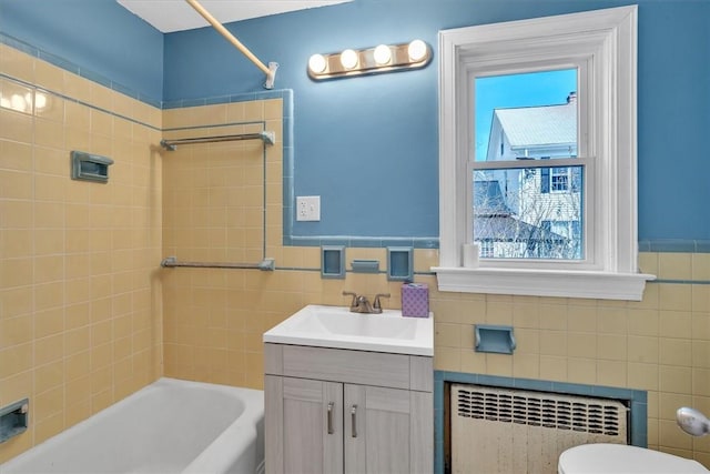 32 Summer St, Woonsocket, RI 02895 - bathroom with vanity, toilet, radiator heating unit, tile walls, and shower / bathing tub combination