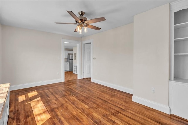 32 Summer St, Woonsocket, RI 02895 - unfurnished room featuring ceiling fan, baseboards, and wood finished floors