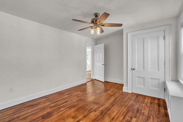 32 Summer St, Woonsocket, RI 02895 - unfurnished bedroom featuring baseboards, ceiling fan, and dark wood-style flooring