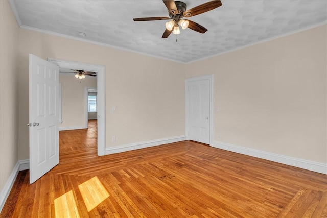 32 Summer St, Woonsocket, RI 02895 - empty room featuring baseboards, crown molding, light wood finished floors, and ceiling fan