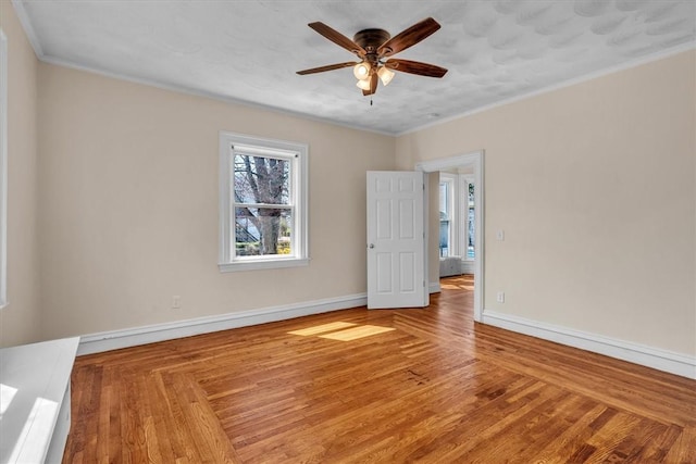 32 Summer St, Woonsocket, RI 02895 - empty room featuring baseboards, ceiling fan, ornamental molding, and wood finished floors