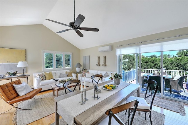 dining room featuring ceiling fan, a wall unit AC, light wood-style flooring, and a wealth of natural light