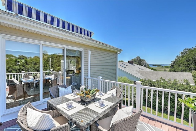 wooden deck featuring outdoor dining space