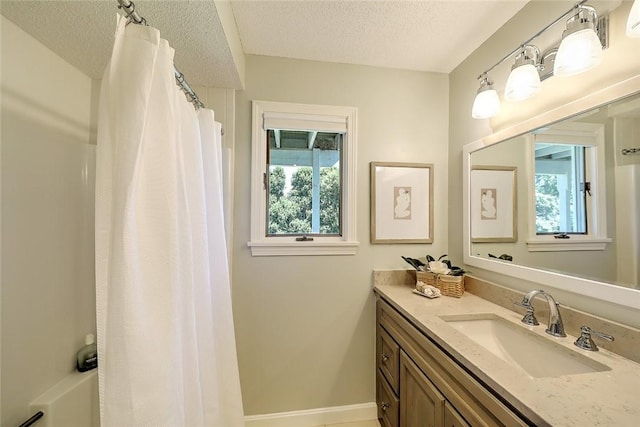 9 Hanley Farm Rd Unit 9, Warren, RI 02885 - full bath with a textured ceiling, vanity, and baseboards