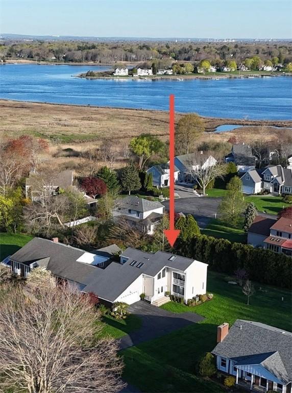 birds eye view of property featuring a residential view and a water view