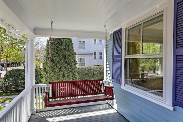 wooden terrace with a porch