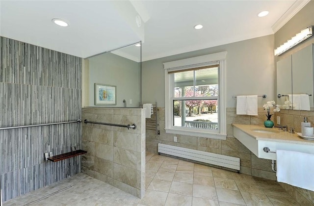 full bathroom with walk in shower, a sink, tile patterned flooring, tile walls, and a baseboard radiator