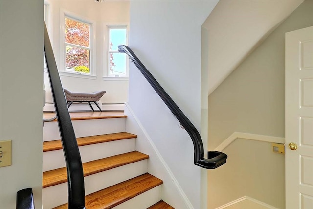 stairway with a baseboard heating unit