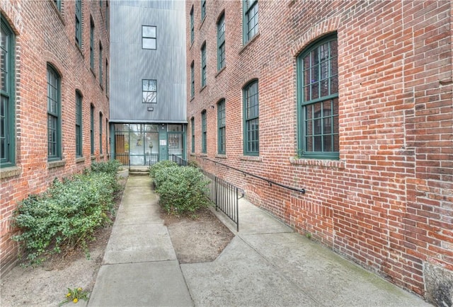exterior space featuring brick siding
