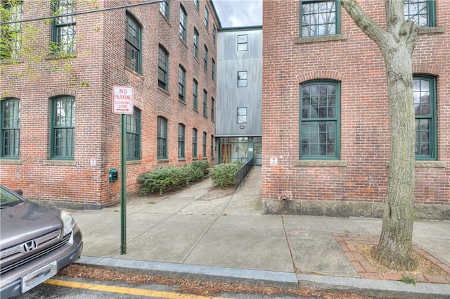 property entrance with brick siding
