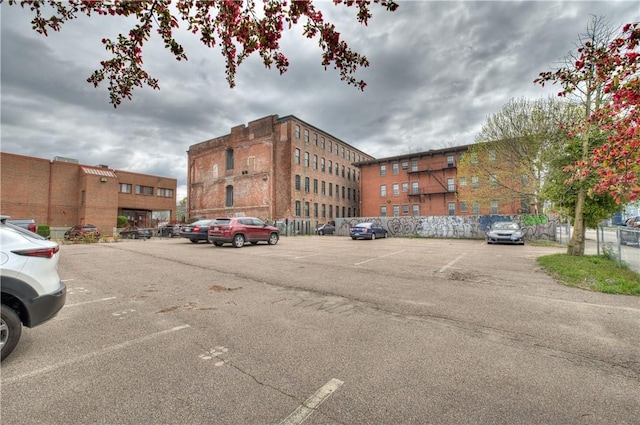 view of property featuring uncovered parking