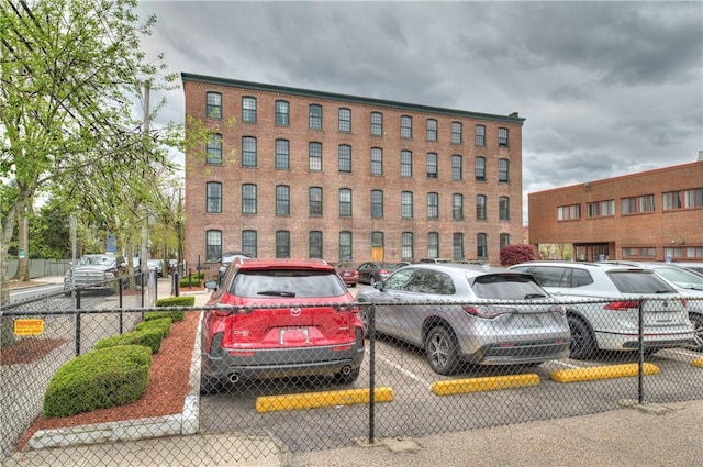 uncovered parking lot with fence
