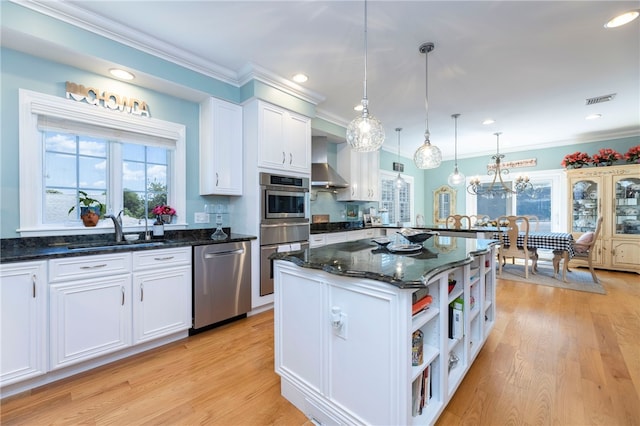 16 Central St, Charlestown, RI 02813 - kitchen with visible vents, open shelves, a sink, stainless steel appliances, and wall chimney exhaust hood