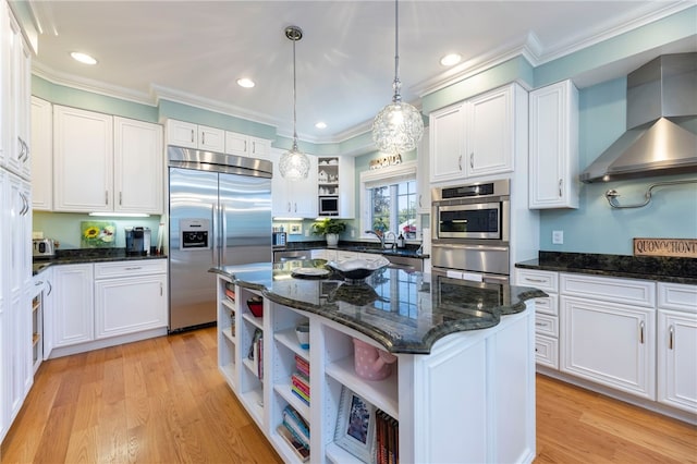 16 Central St, Charlestown, RI 02813 - kitchen with open shelves, stainless steel appliances, wall chimney exhaust hood, and white cabinetry