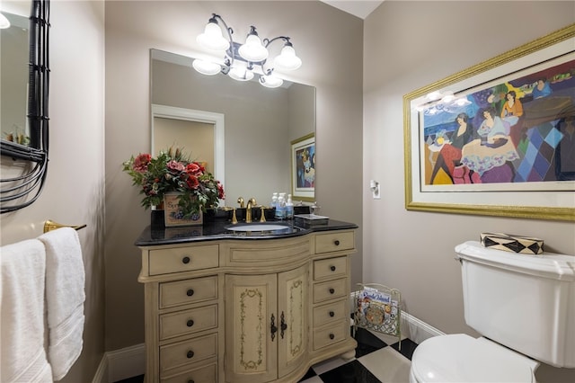 16 Central St, Charlestown, RI 02813 - bathroom with vanity, baseboards, a notable chandelier, and toilet