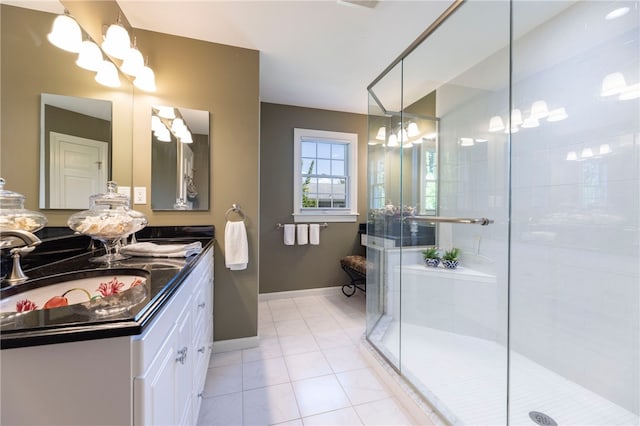 16 Central St, Charlestown, RI 02813 - bathroom featuring an inviting chandelier, vanity, tile patterned flooring, and a shower stall