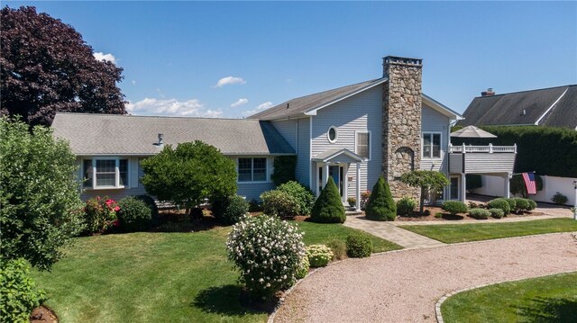 16 Central St, Charlestown, RI 02813 - view of front of home featuring a chimney and a front yard