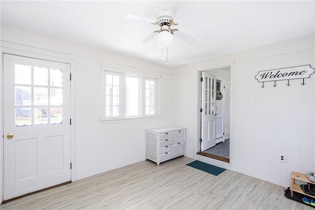 foyer entrance featuring light wood finished floors and ceiling fan