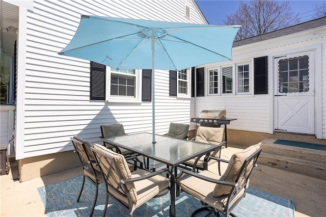 view of patio featuring area for grilling and outdoor dining area