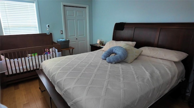 bedroom featuring a closet and wood finished floors
