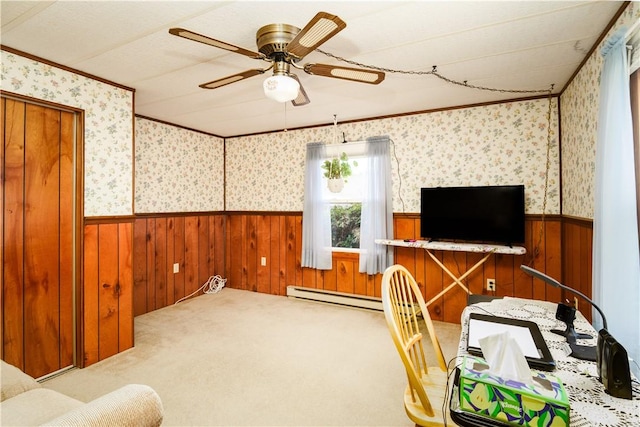 office area with a wainscoted wall, a baseboard heating unit, and wood walls