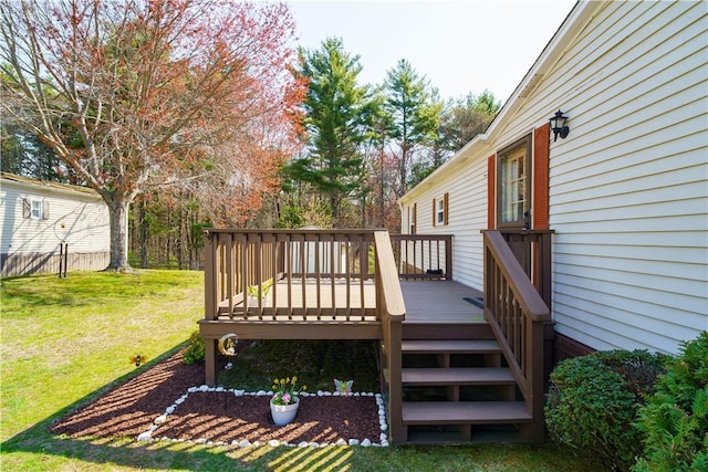 wooden deck with a lawn